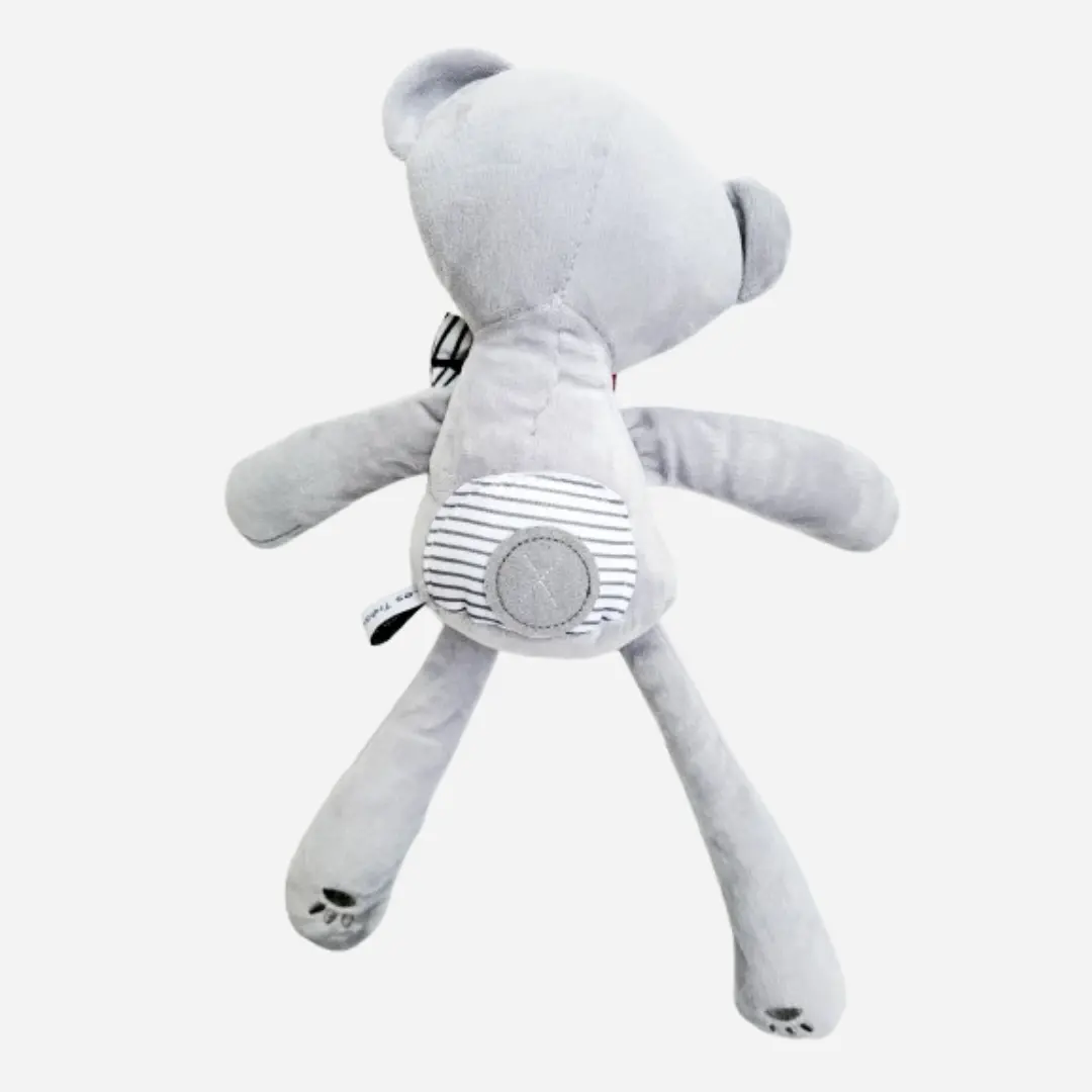 Vue de dos du doudou ours en peluche Teddy Wax RUBÉLYS en coton gris, peluche artisanale douce et raffinée pour bébé