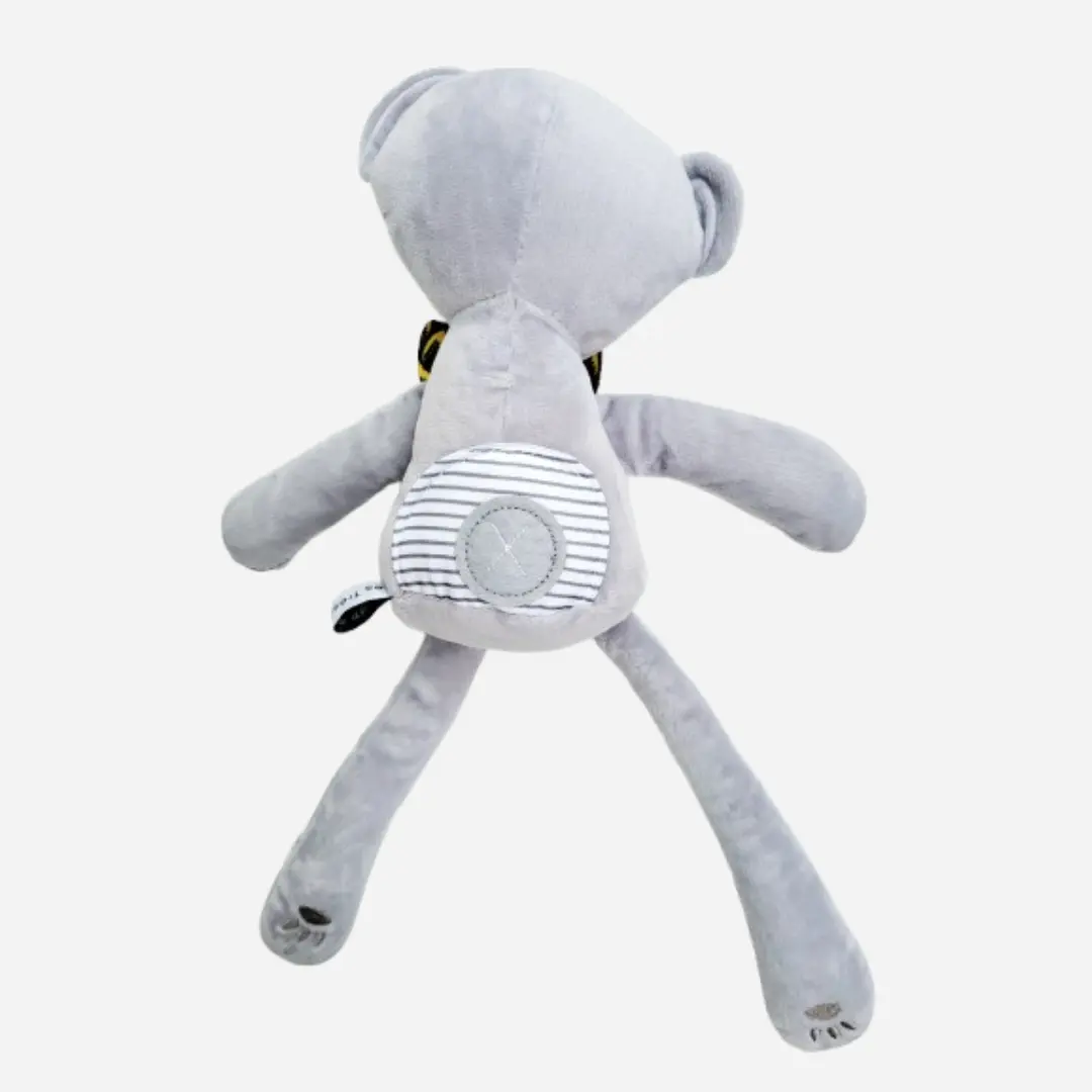 Vue de dos du doudou ours en peluche Teddy Wax SANOHA en coton gris, peluche artisanale douce et raffinée