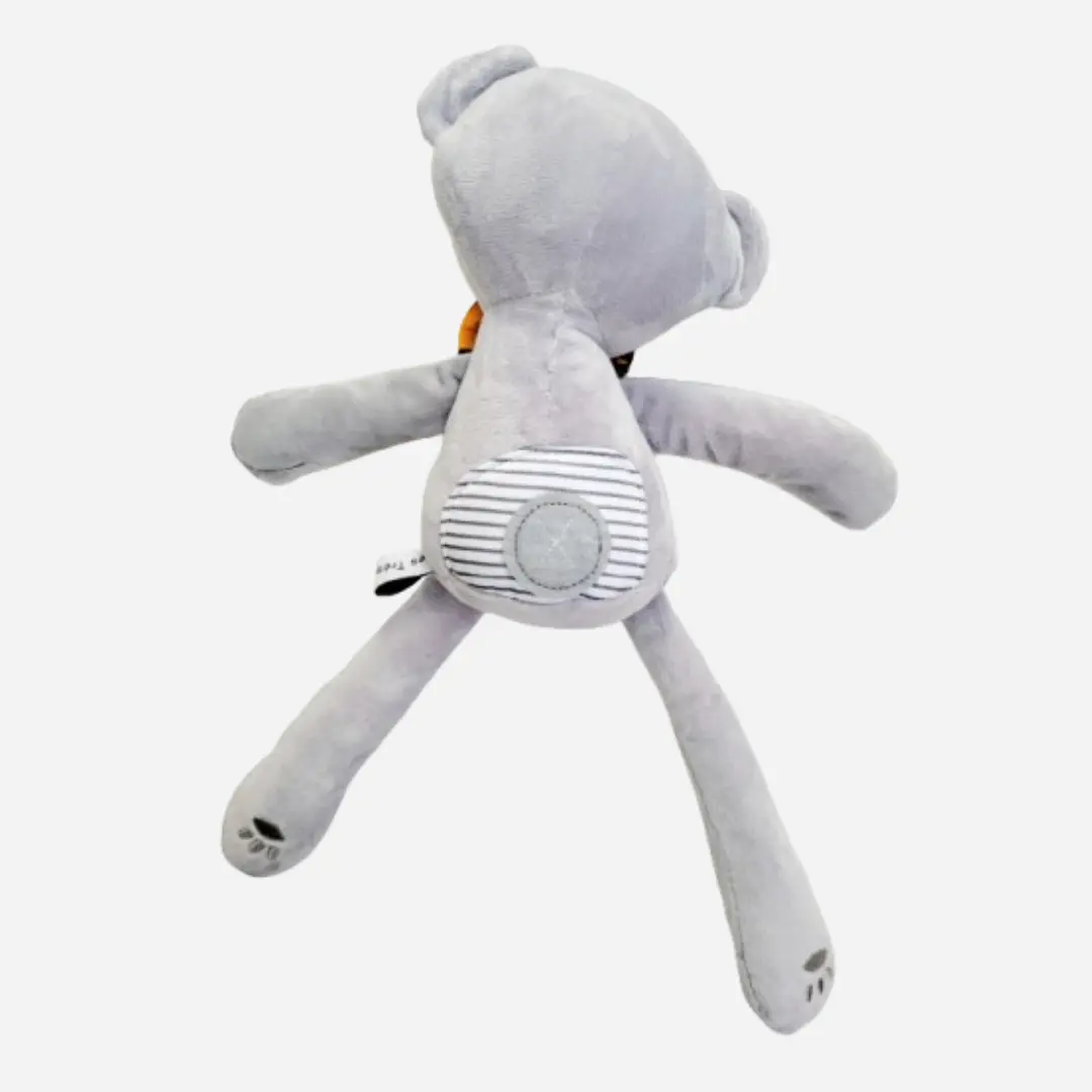 Vue de dos du doudou ours en peluche Teddy Wax TÉORÉ en coton gris, peluche artisanale douce et raffinée